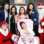 Fertitta Entertainment’s Patrick Fertitta and Houston Children’s Charity President & CEO, Laura Ward, are photographed with the Escobar Family, one of 15 households who received wheelchair-accessible vans last week through the Chariots for Children program.