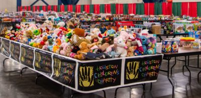 Parents shop for Christmas presents at the Houston Children's Charity annual Toys for Tots distribution at the George R Brown Convention Center on Friday, December 20, 2019 in Houston, Texas.